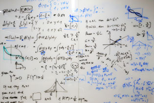 A photo of a whiteboard with writing