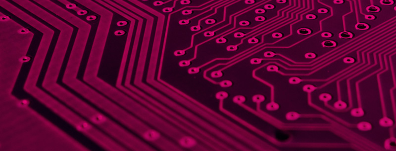 an extreme closeup of a circuit board given a rubine red overlay