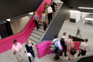 Photo of students walking down the main Rotman staircase