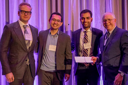 International MBA Stock Picking Competition Winning Team; from l to r;  Michael Sproule JD/MBA '20, Frederico Gomes, MBA '19, and Vinicius Vilhena, MBA '19 with Robert Robotti, Robotti & Company Advisors LLC.